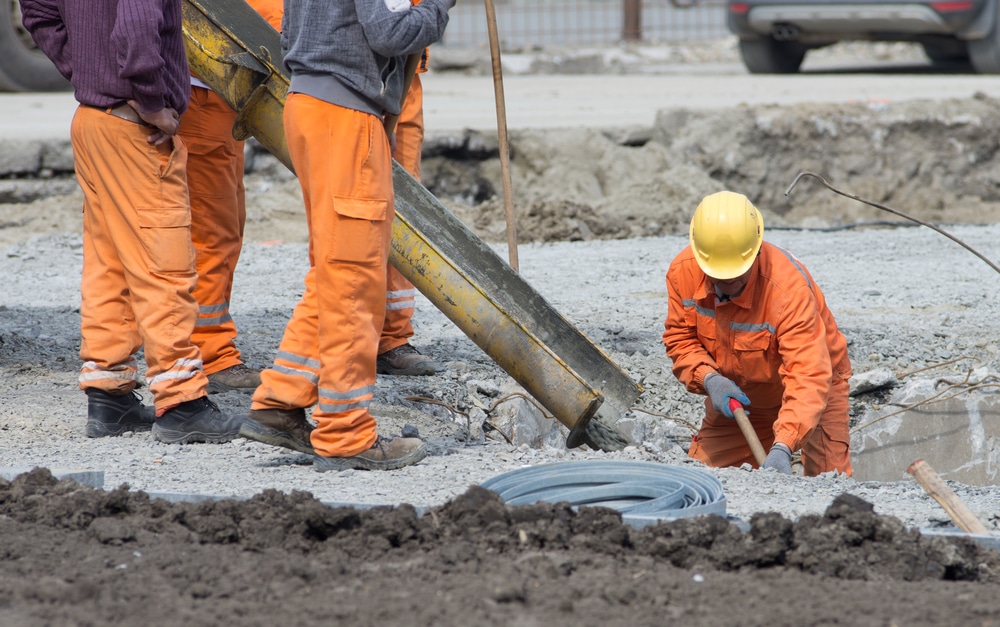 Wallace-Law-Services-08 Five men working at a construction site.